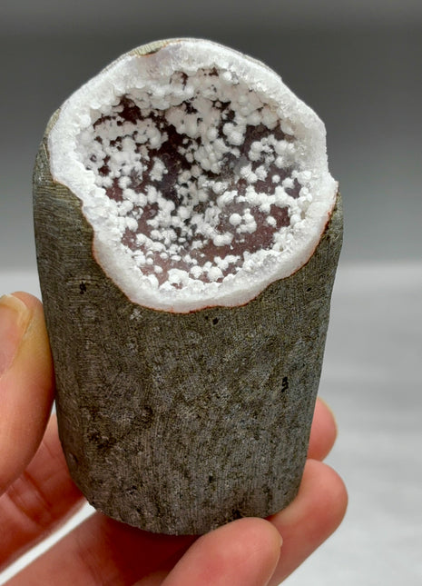Okenite Snowballs with Red Quartz Geode